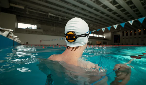 Swimmer wearing a bone conduction headset